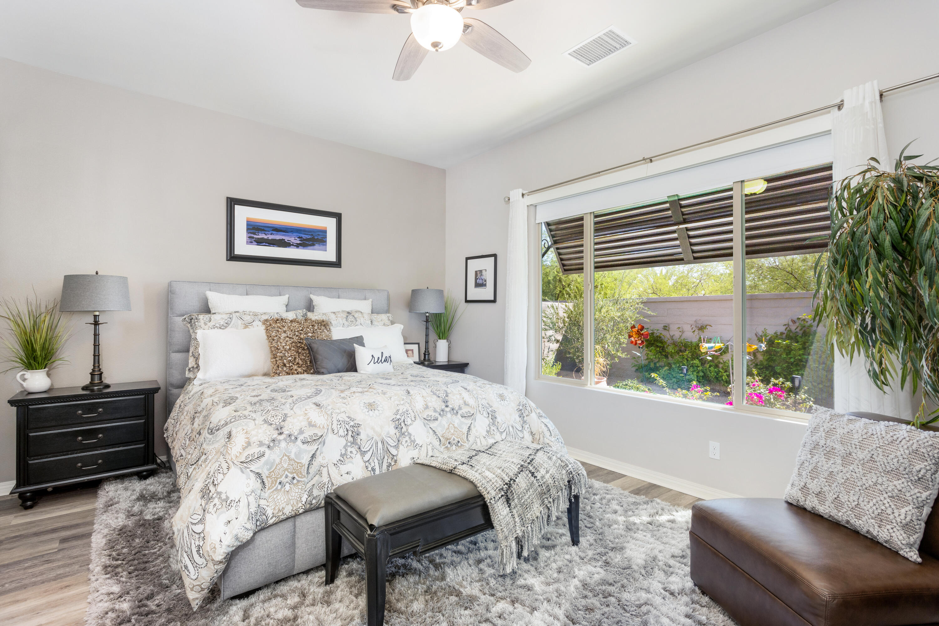 61 Syrah Rancho Mirage, CA 92270 - Photo 21 of 61 a bedroom with a bed and a large window