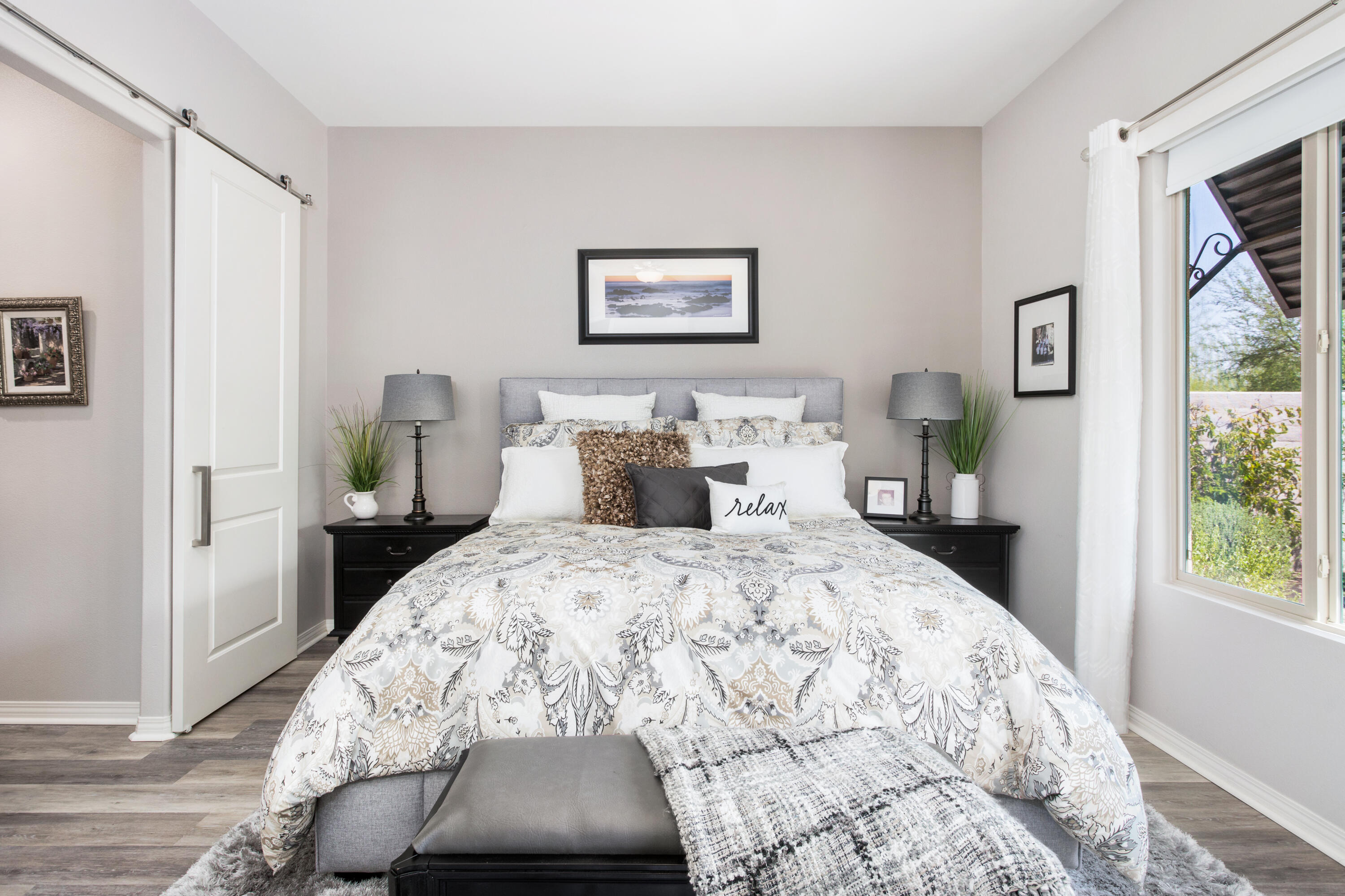 61 Syrah Rancho Mirage, CA 92270 - Photo 22 of 61 a bedroom with a bed and a painting on the wall