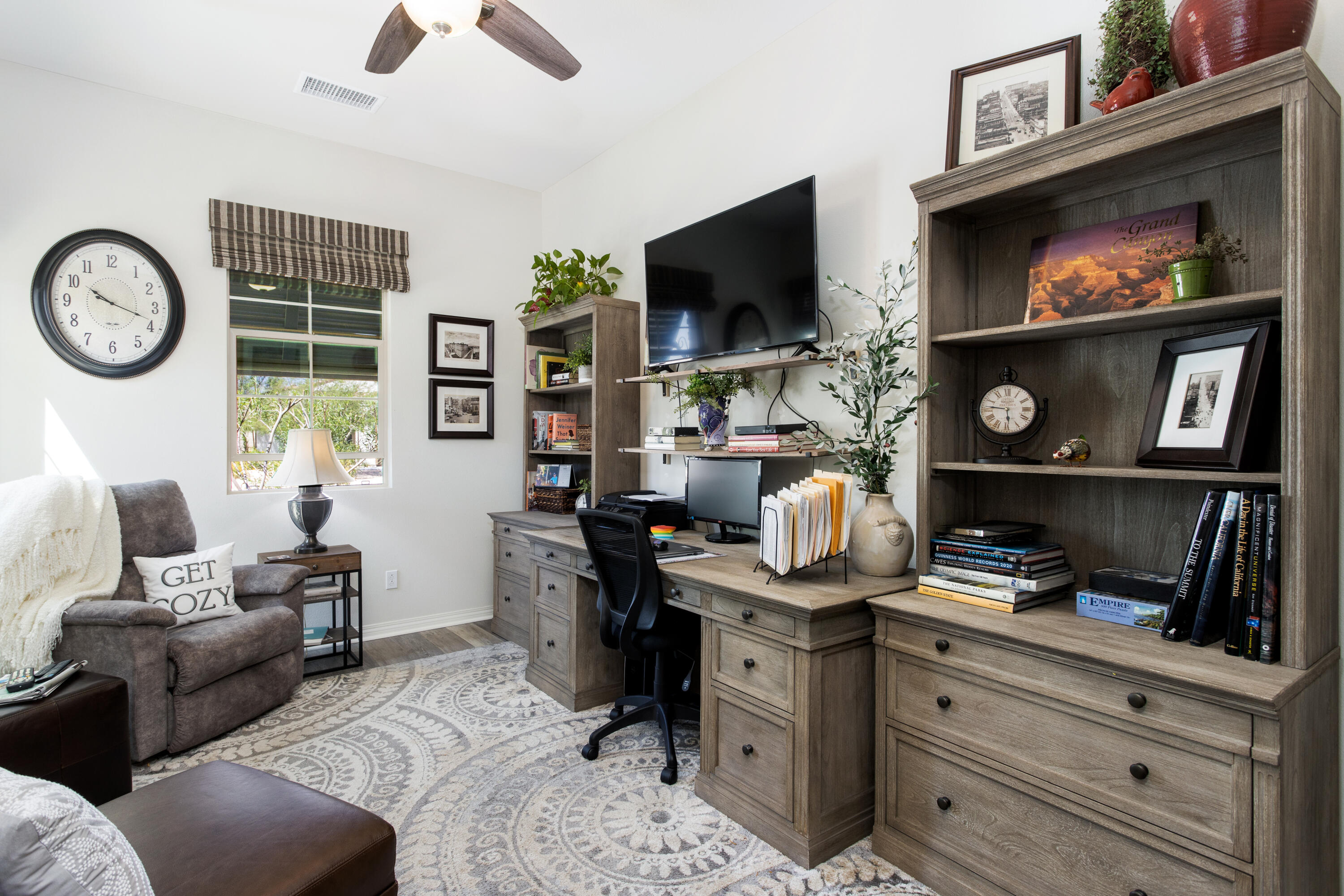 61 Syrah Rancho Mirage, CA 92270 - Photo 29 of 61 a living room with furniture a flat screen tv and a fireplace