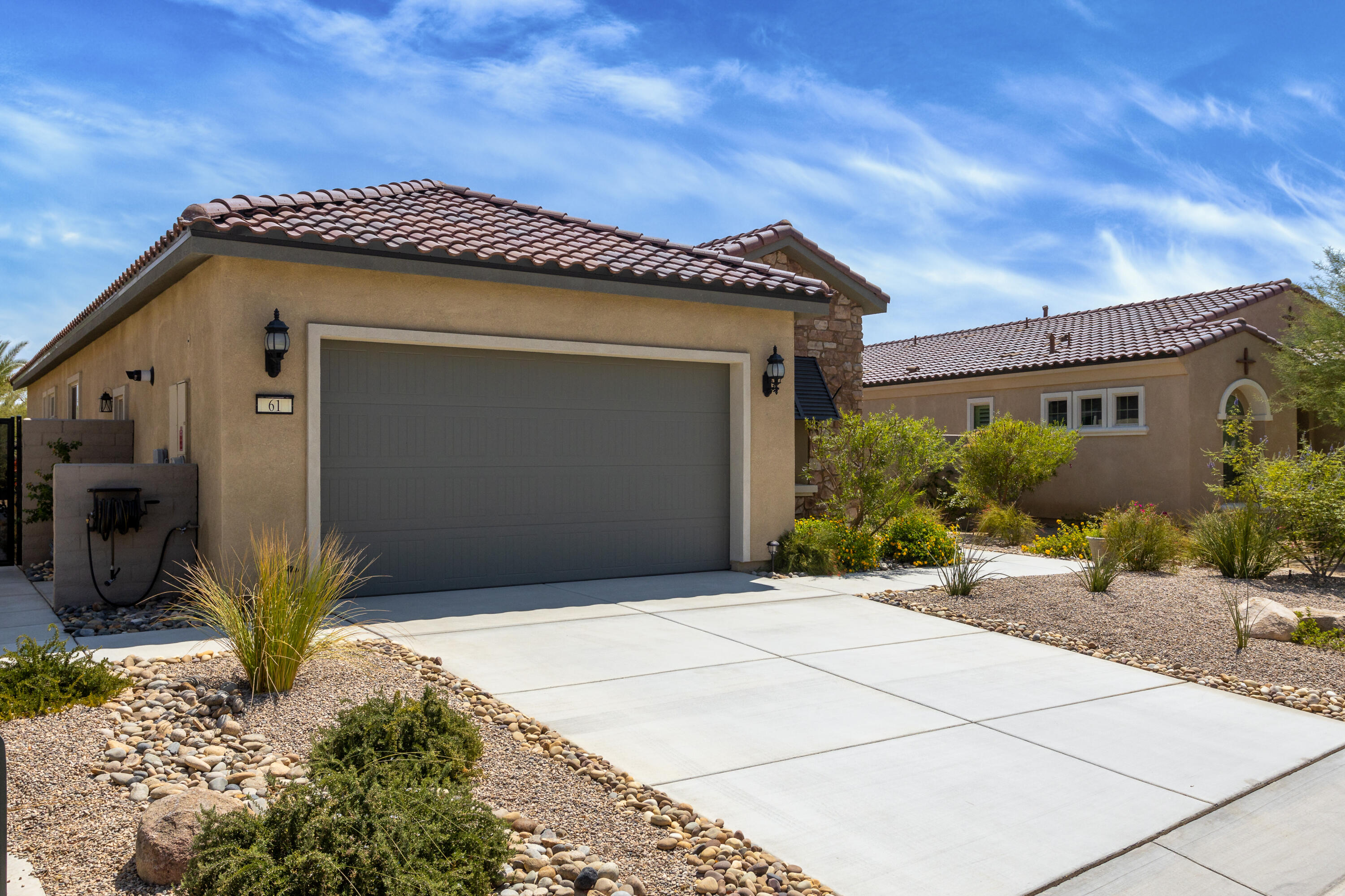 61 Syrah Rancho Mirage, CA 92270 - Photo 44 of 61 a front view of a house with a garden