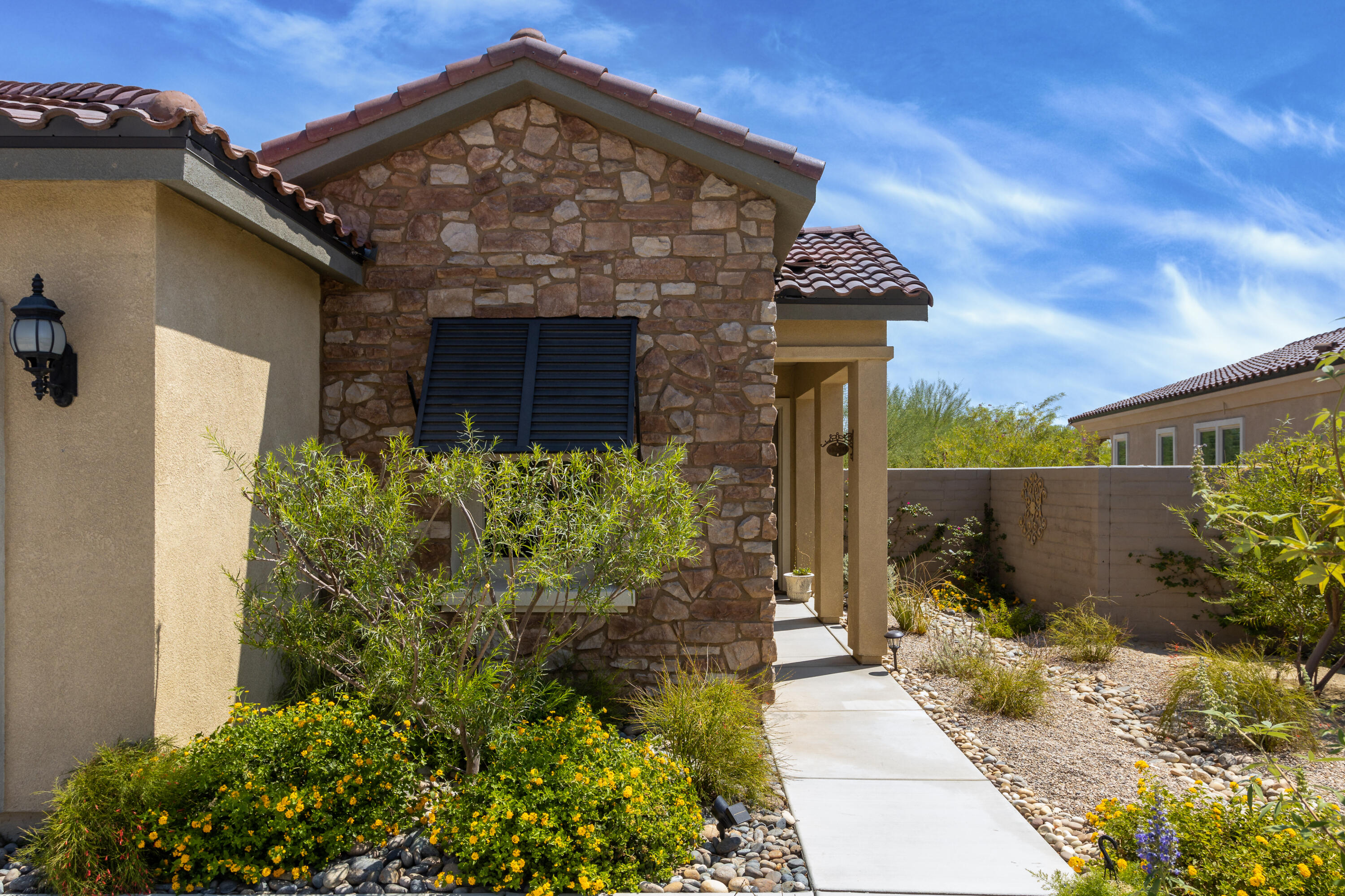 61 Syrah Rancho Mirage, CA 92270 - Photo 45 of 61 a front view of a house with a yard