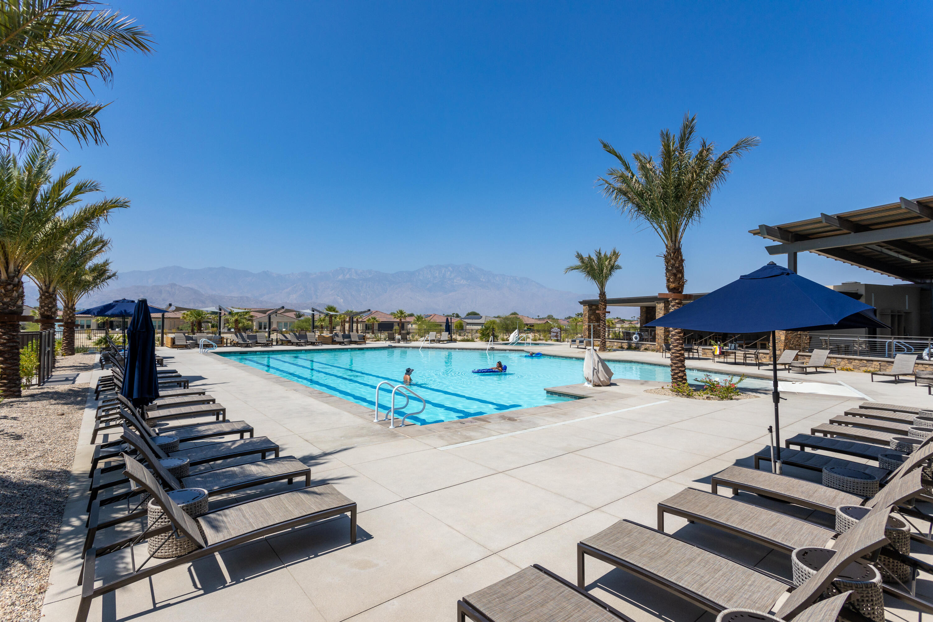 61 Syrah Rancho Mirage, CA 92270 - Photo 51 of 61 a view of a patio with a table and chairs under an umbrella
