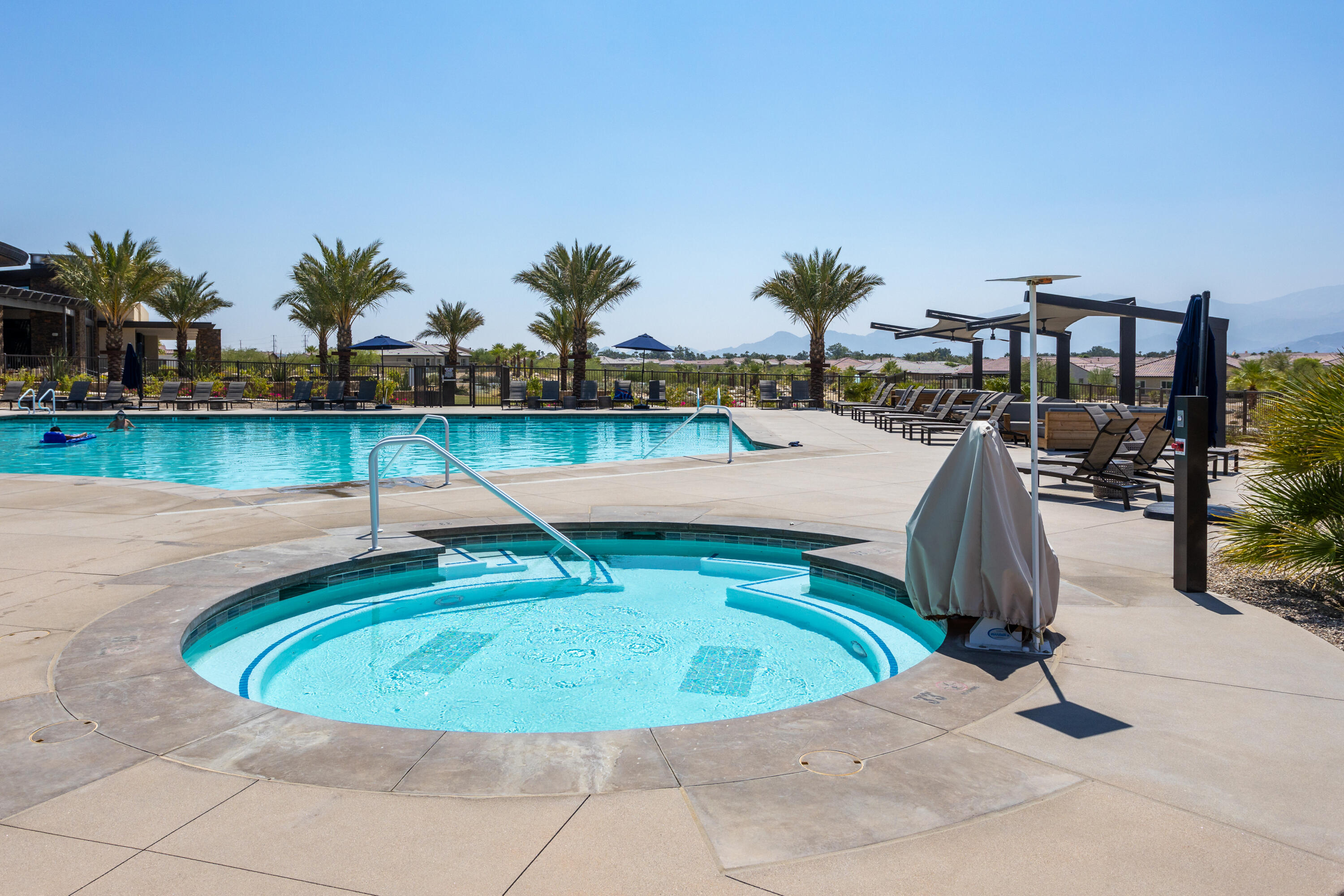 61 Syrah Rancho Mirage, CA 92270 - Photo 53 of 61 a view of a swimming pool with a lounge chairs