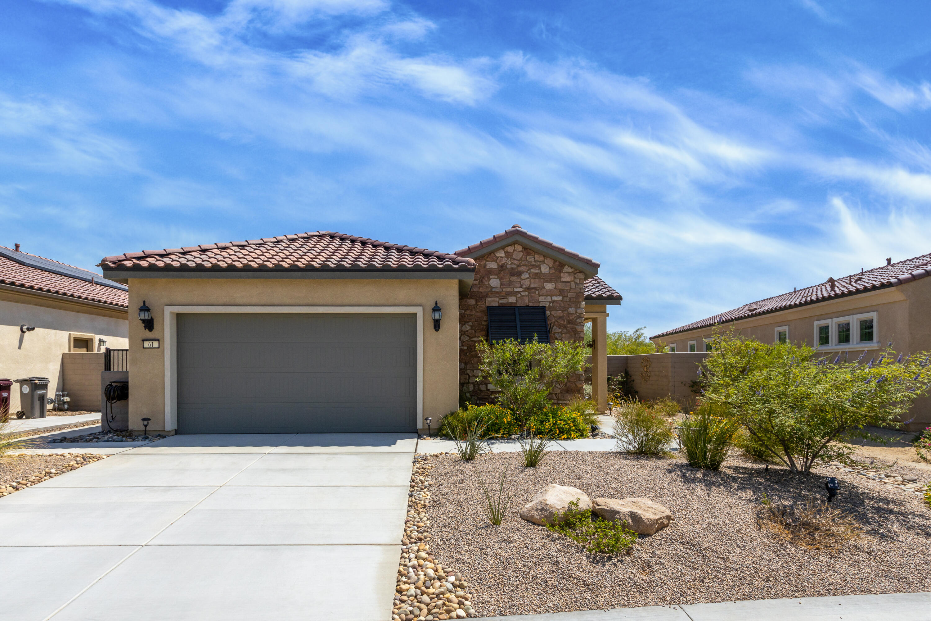 61 Syrah Rancho Mirage, CA 92270 - Photo 60 of 61 a front view of a house with a yard