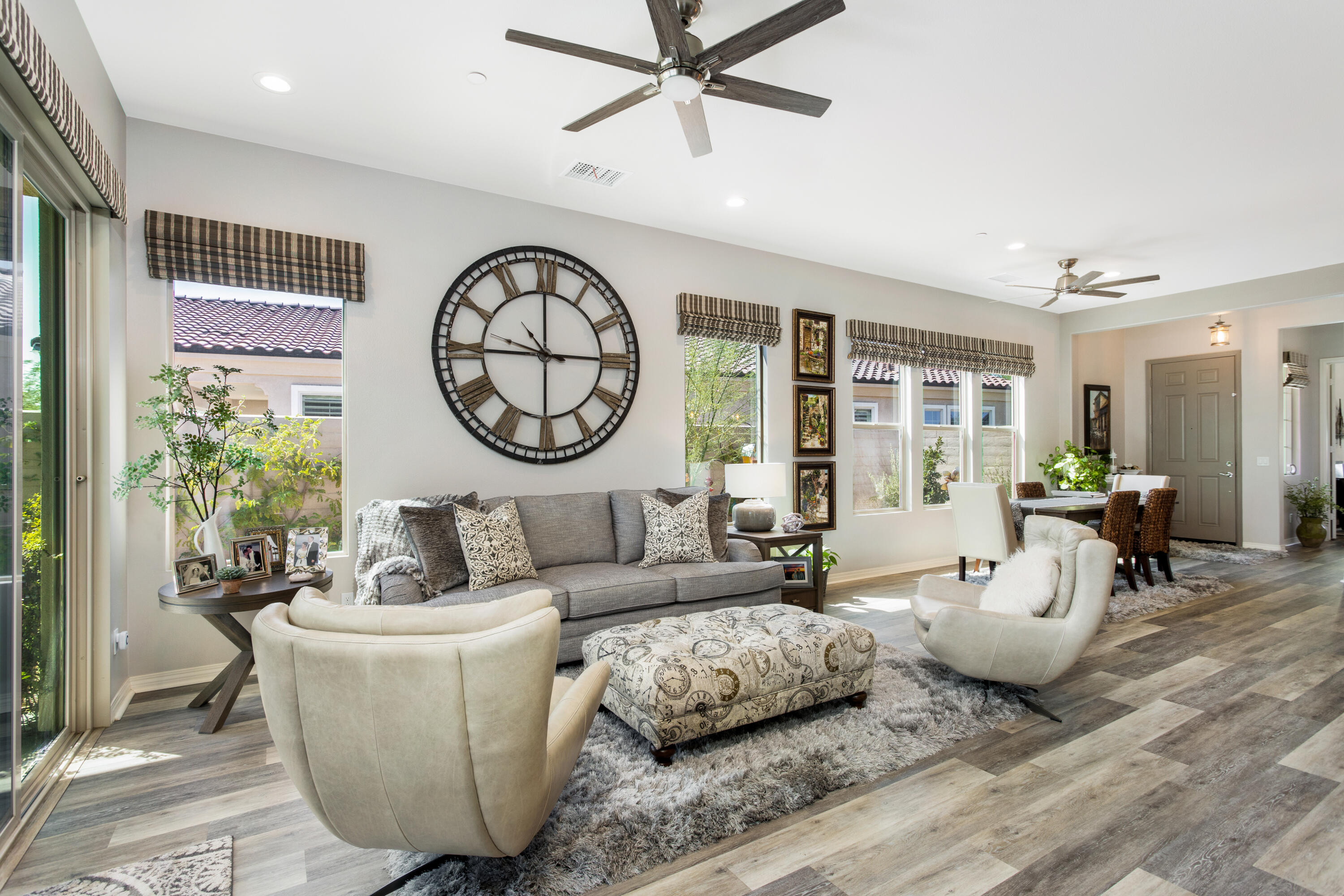 61 Syrah Rancho Mirage, CA 92270 - Photo 6 of 61 a living room with furniture a clock and a large window