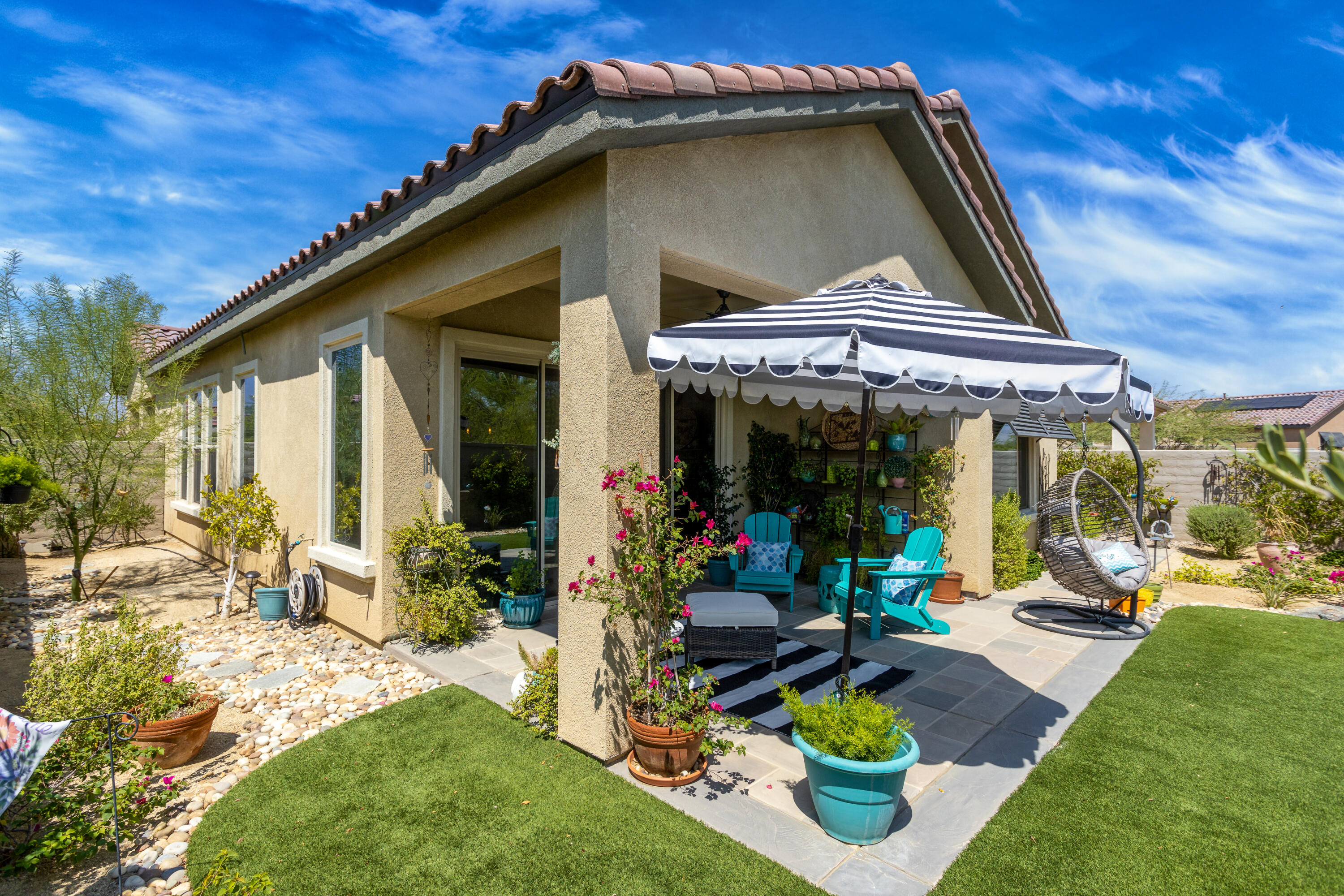 61 Syrah Rancho Mirage, CA 92270 - Photo 7 of 61 a view of the house with backyard porch and sitting area
