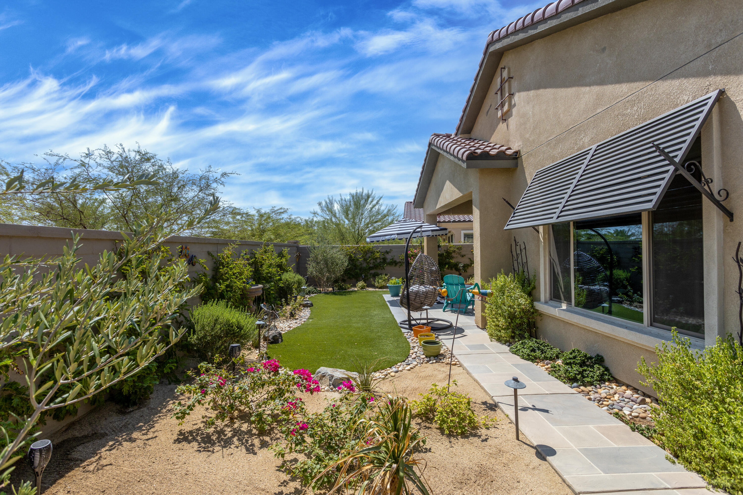 61 Syrah Rancho Mirage, CA 92270 - Photo 8 of 61 a front view of a house with garden