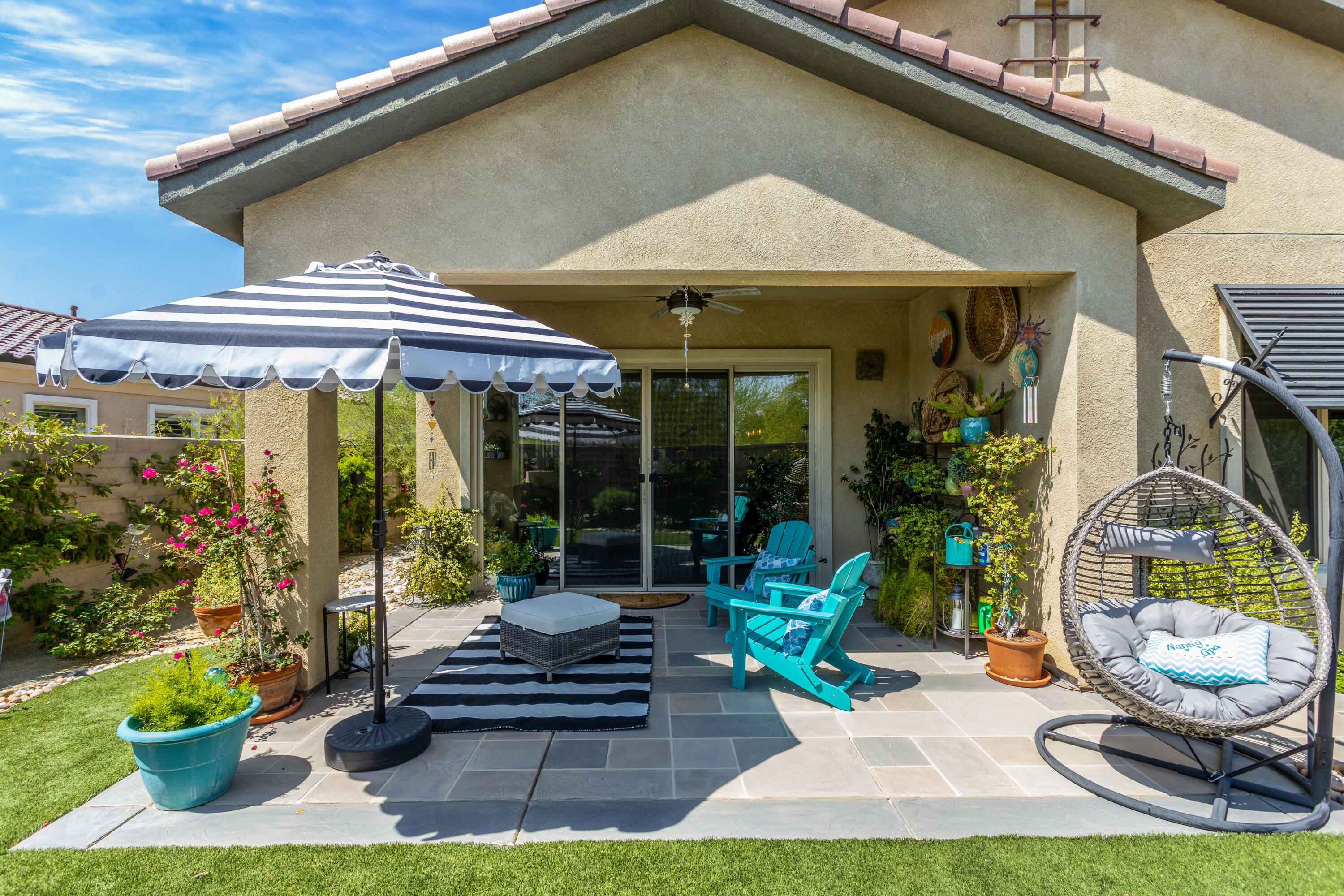 61 Syrah Rancho Mirage, CA 92270 - Photo 9 of 61 a front view of a house with garden and sitting area