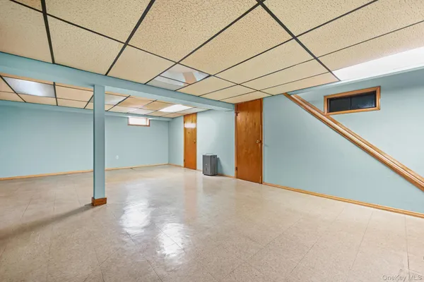 a bathroom with a sink a mirror and shower