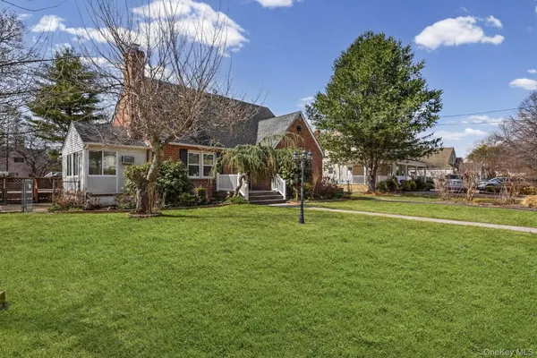 a view of a house with a backyard