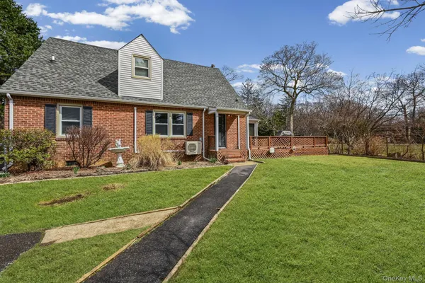 a view of a tree in front of a house