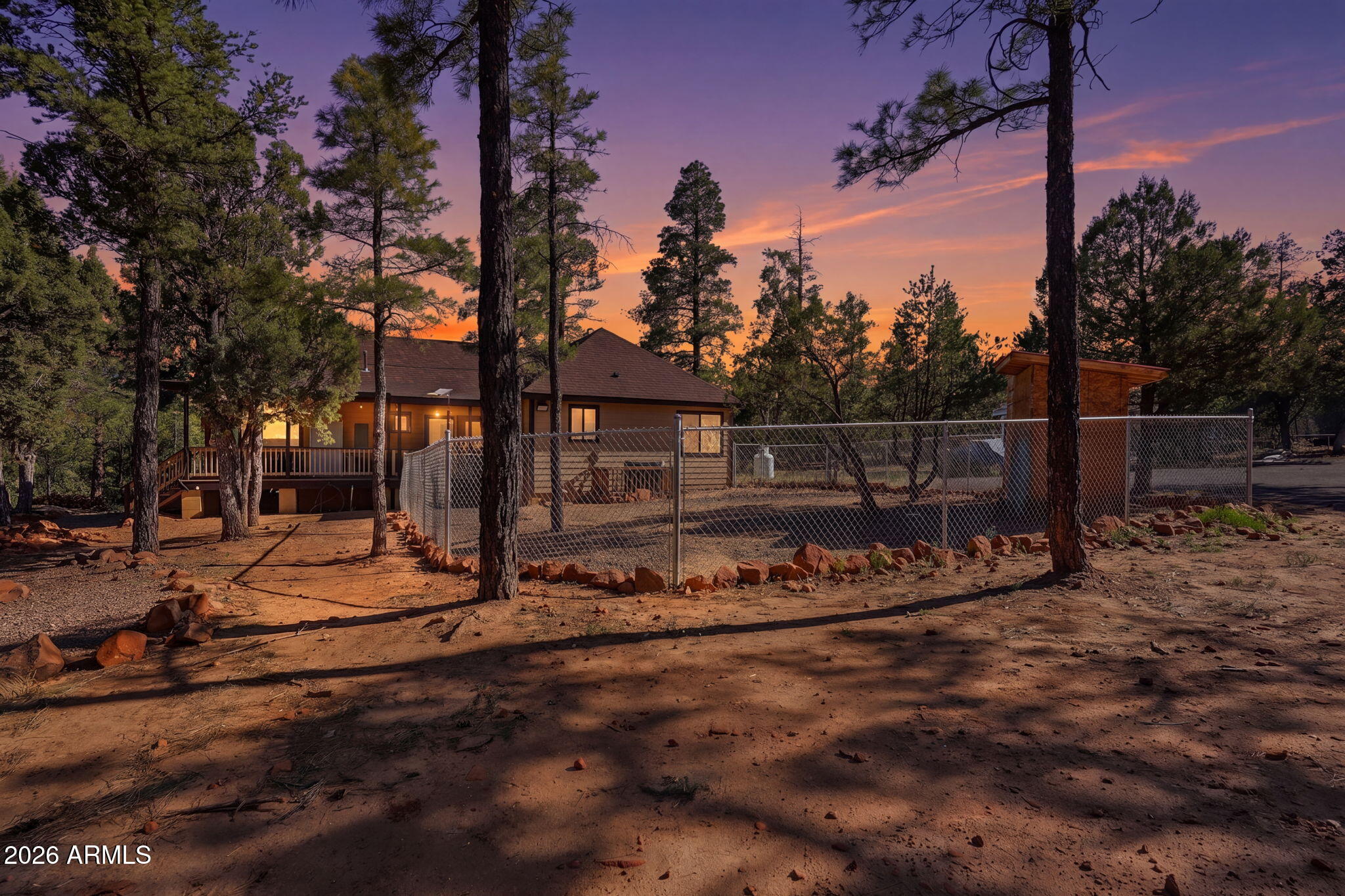 2060 Gilbert Lane Overgaard, AZ 85933 - Photo 84 of 87 a view of a barn with wooden fence