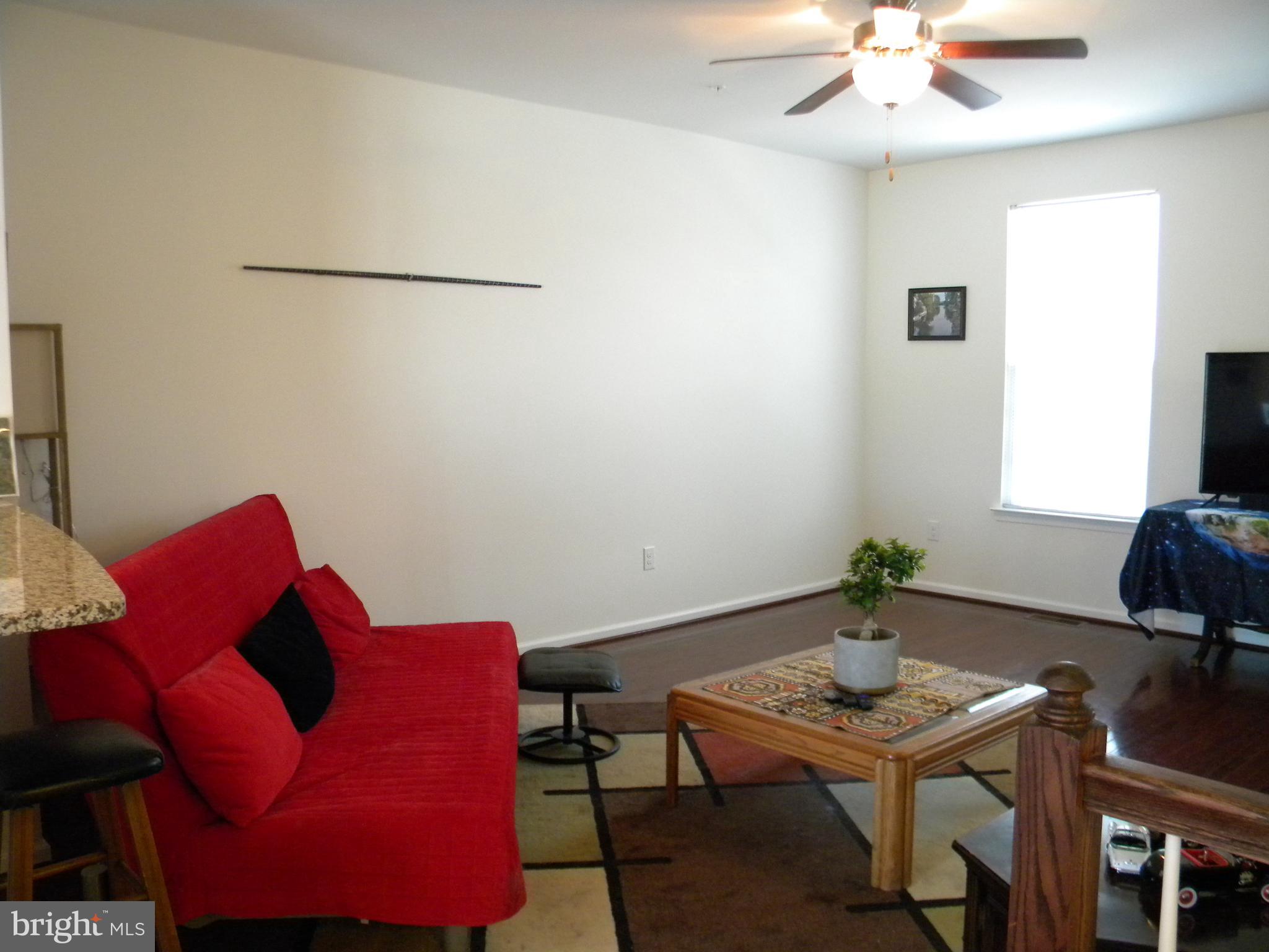 652 East Chestnut Street Souderton, PA 18964 - Photo 4 of 20 a living room with furniture and a table
