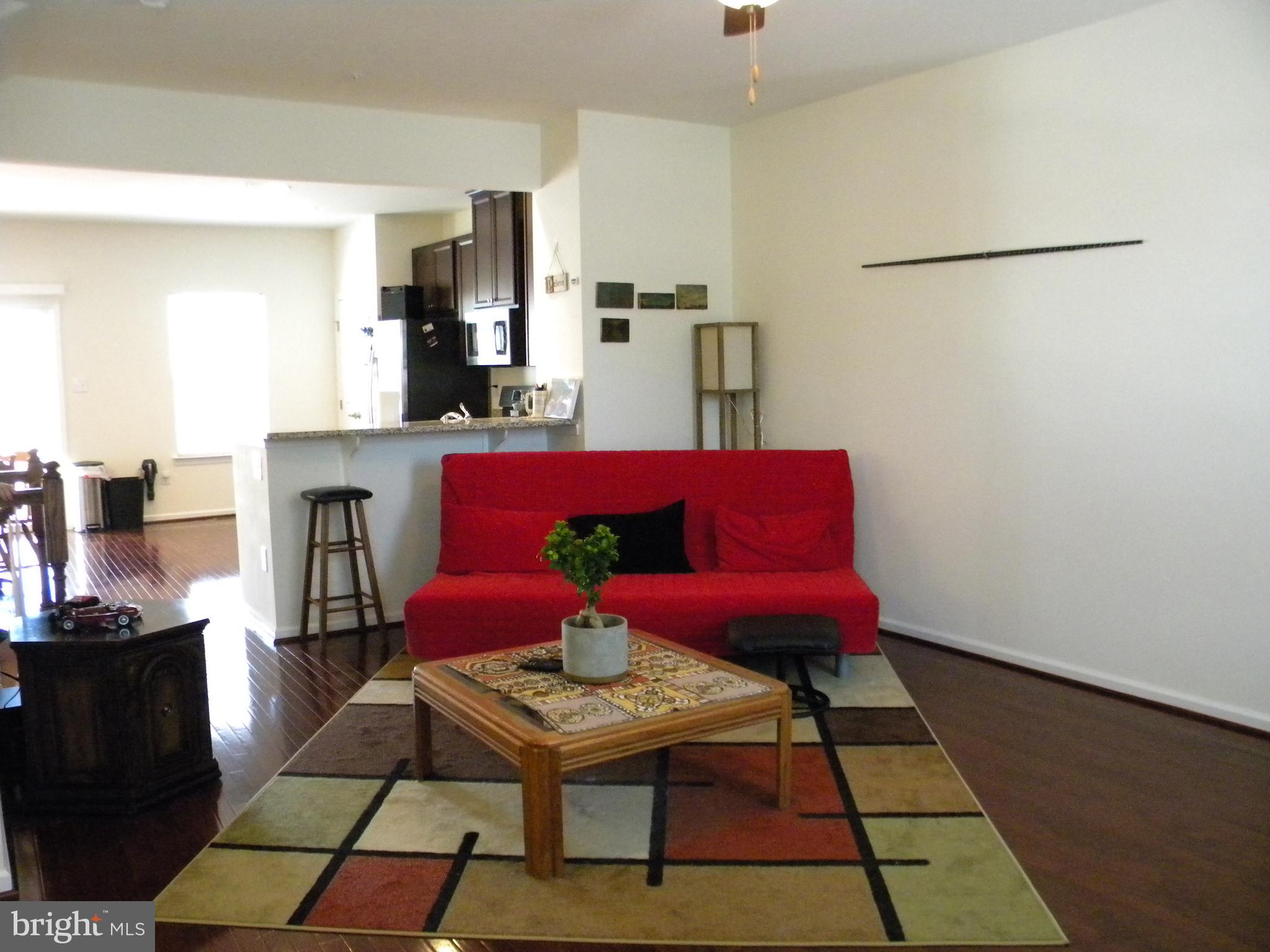 652 East Chestnut Street Souderton, PA 18964 - Photo 5 of 20 a living room with furniture and a rug