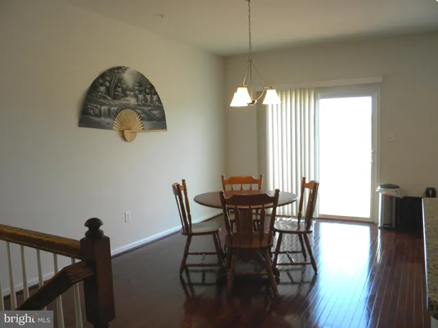 a view of a dining room with furniture and window