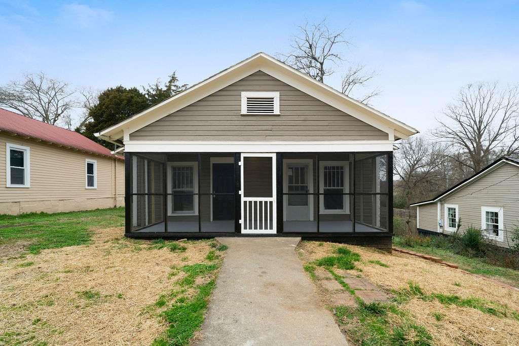 425 North Marble Street Rockmart, GA 30153 - Photo 1 of 26 a front view of a house with a garden