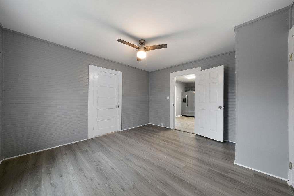 425 North Marble Street Rockmart, GA 30153 - Photo 16 of 26 a view of an empty room with wooden floor and a ceiling fan