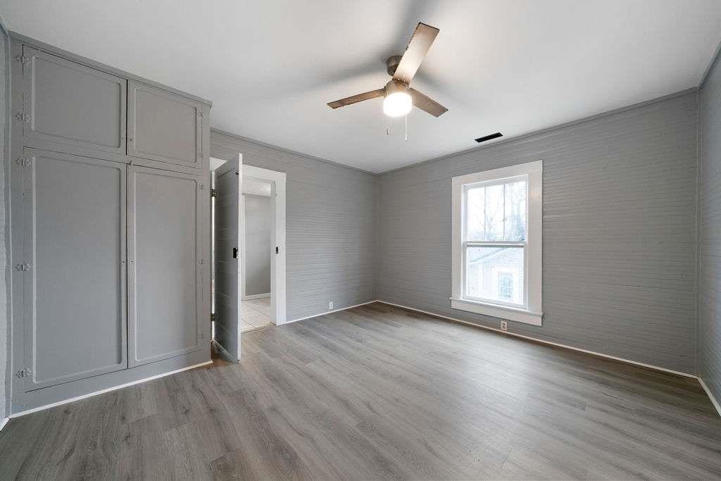 425 North Marble Street Rockmart, GA 30153 - Photo 17 of 26 a view of an empty room with wooden floor and a window