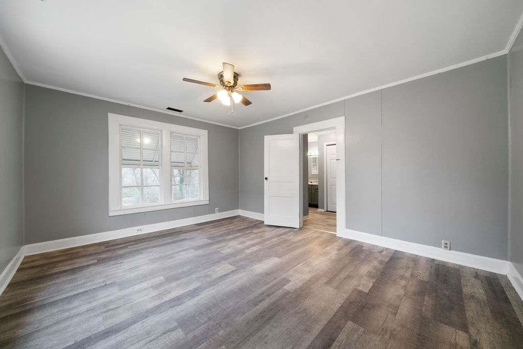 425 North Marble Street Rockmart, GA 30153 - Photo 4 of 26 a view of empty room with wooden floor and fan