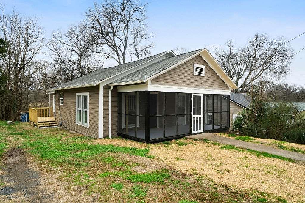 425 North Marble Street Rockmart, GA 30153 - Photo 6 of 26 a front view of a house with a yard and garage