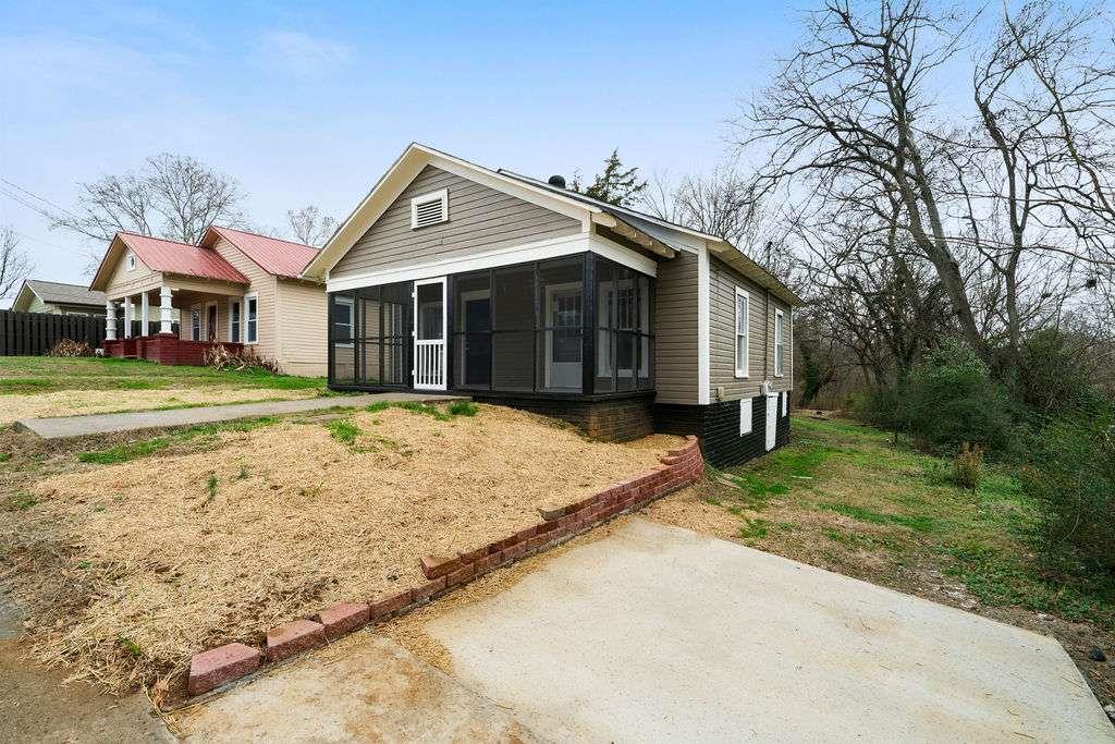 425 North Marble Street Rockmart, GA 30153 - Photo 7 of 26 a front view of a house with a yard and garage