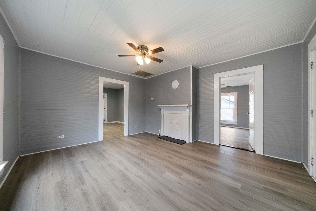 425 North Marble Street Rockmart, GA 30153 - Photo 9 of 26 a view of an empty room with a window and wooden floor