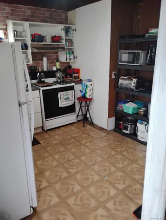 a utility room with sink dryer and washer