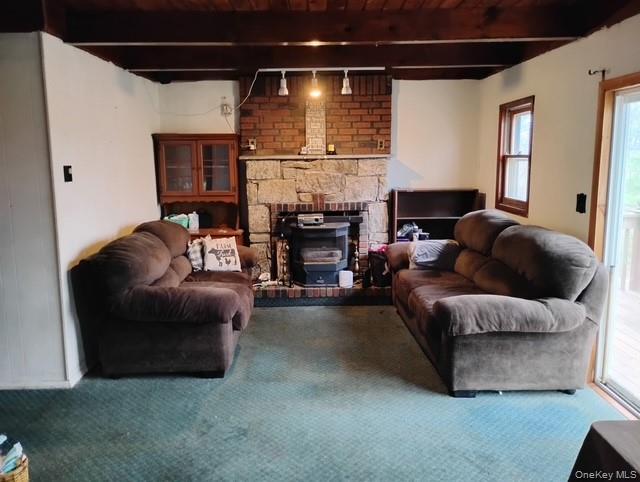 120 Swallow Court Bushkill, PA 18324 - Photo 28 of 39 a living room with furniture and a fireplace