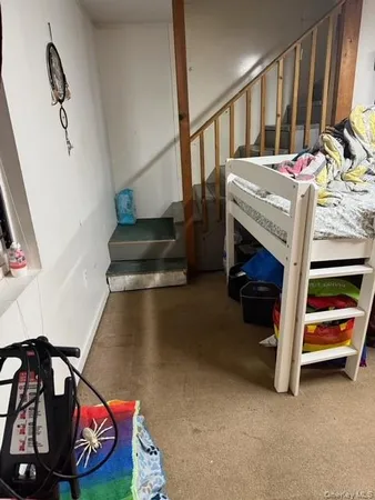 a room with furniture and a gym machine