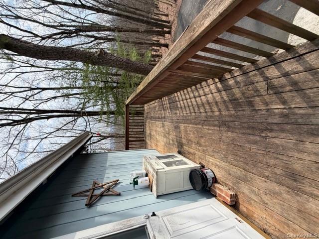120 Swallow Court Bushkill, PA 18324 - Photo 10 of 39 a view of balcony with wooden floor and fence and a pot