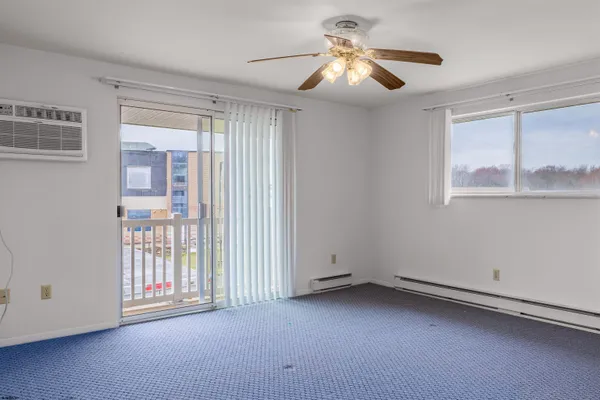 a view of an empty room with a window