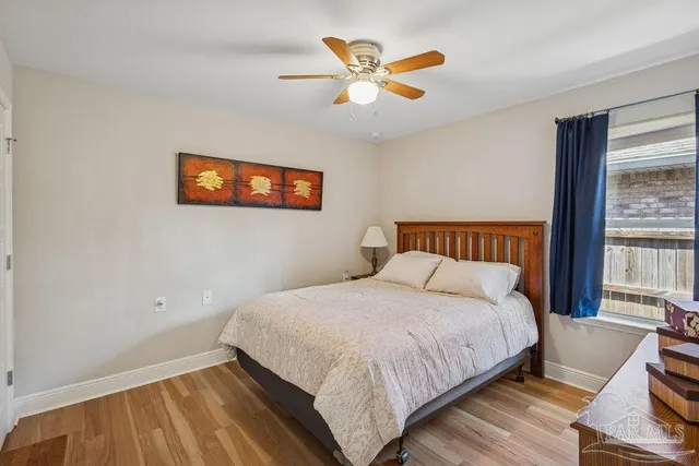 a bedroom with a bed and window