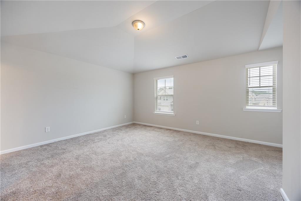 116 Cabin Way Hampton, GA 30228 - Photo 18 of 32 an empty room with windows