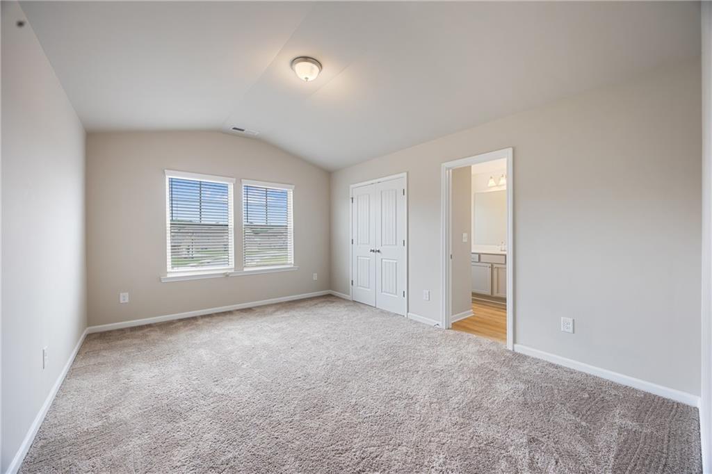 116 Cabin Way Hampton, GA 30228 - Photo 29 of 32 an empty room with windows and closet