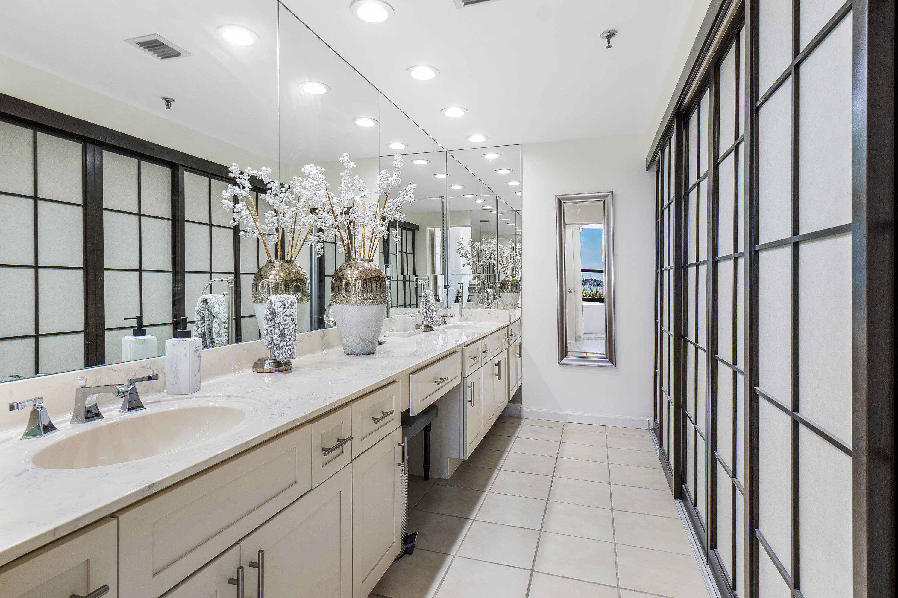 3120 South Ocean Boulevard, Unit 1502 Palm Beach, FL 33480 - Photo 13 of 26 a large white bathroom with a double vanity sink a mirror and a shower