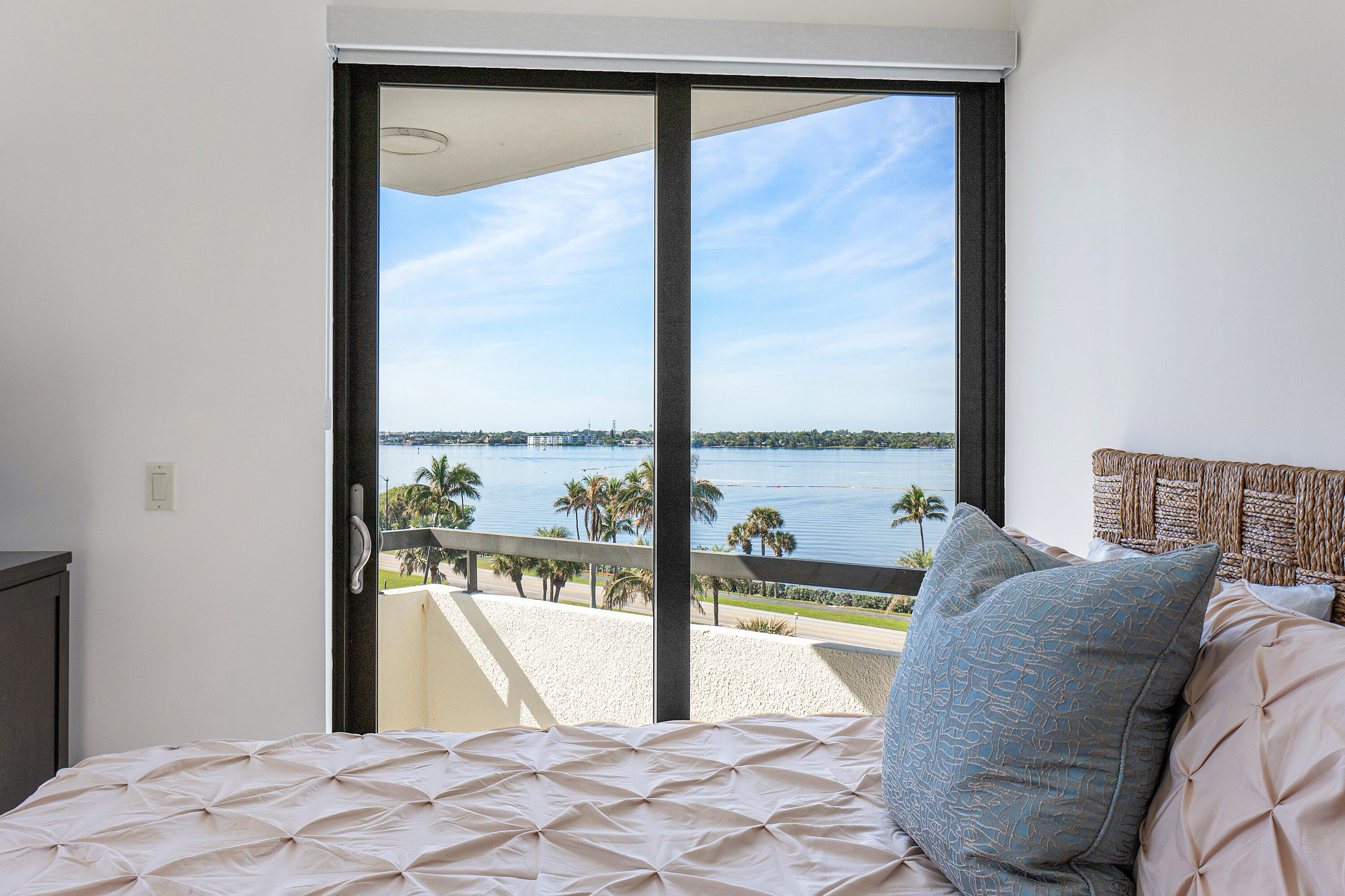 3120 South Ocean Boulevard, Unit 1502 Palm Beach, FL 33480 - Photo 15 of 26 a view of a bedroom with a bed and dining table