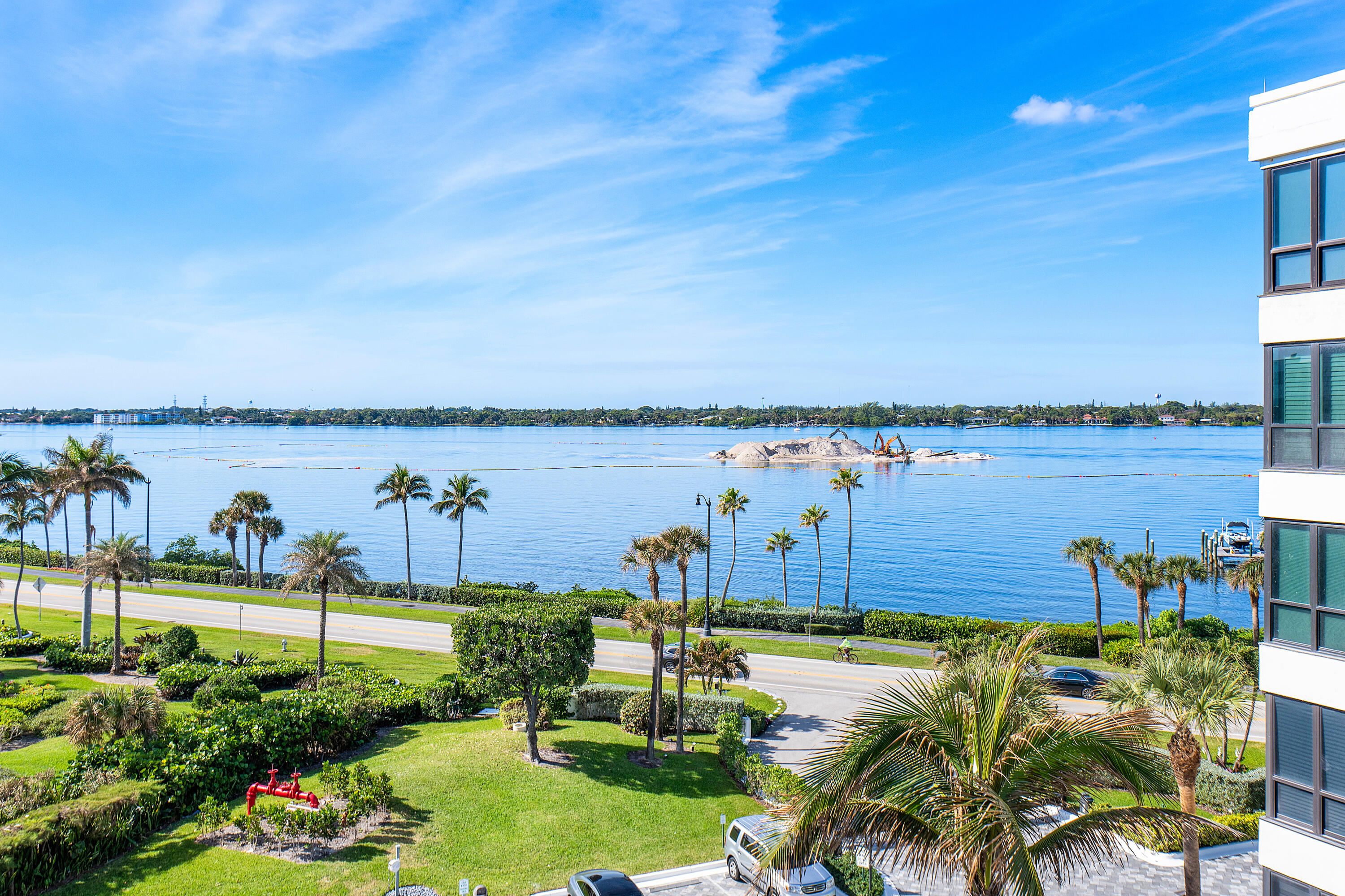 3120 South Ocean Boulevard, Unit 1502 Palm Beach, FL 33480 - Photo 19 of 26 a view of a lake with a garden