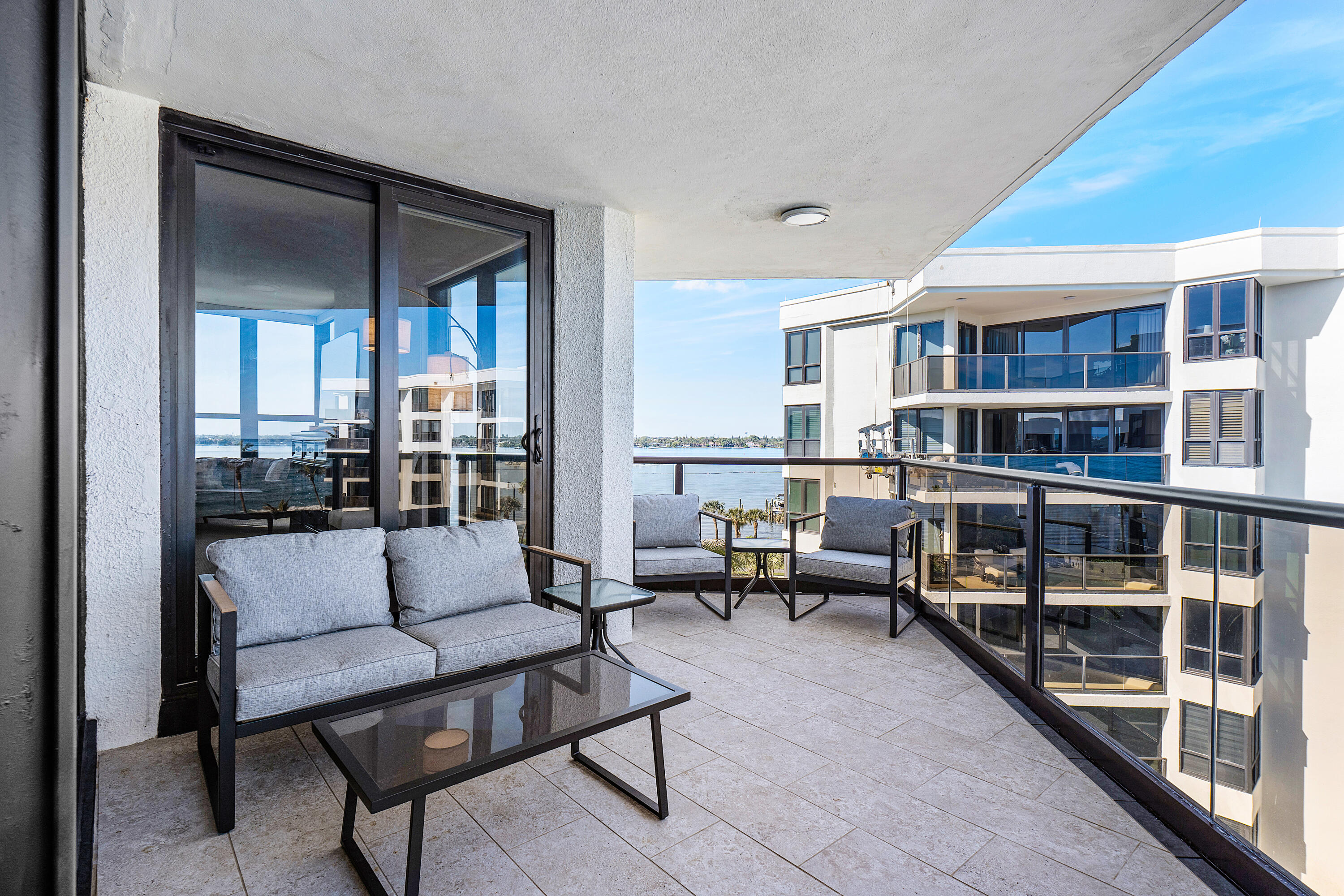 3120 South Ocean Boulevard, Unit 1502 Palm Beach, FL 33480 - Photo 21 of 26 a living room with furniture and a table