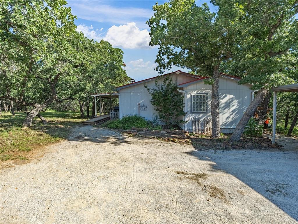 3275 Finis Road Graham, TX 76450 - Photo 28 of 36 a view of a house with a yard
