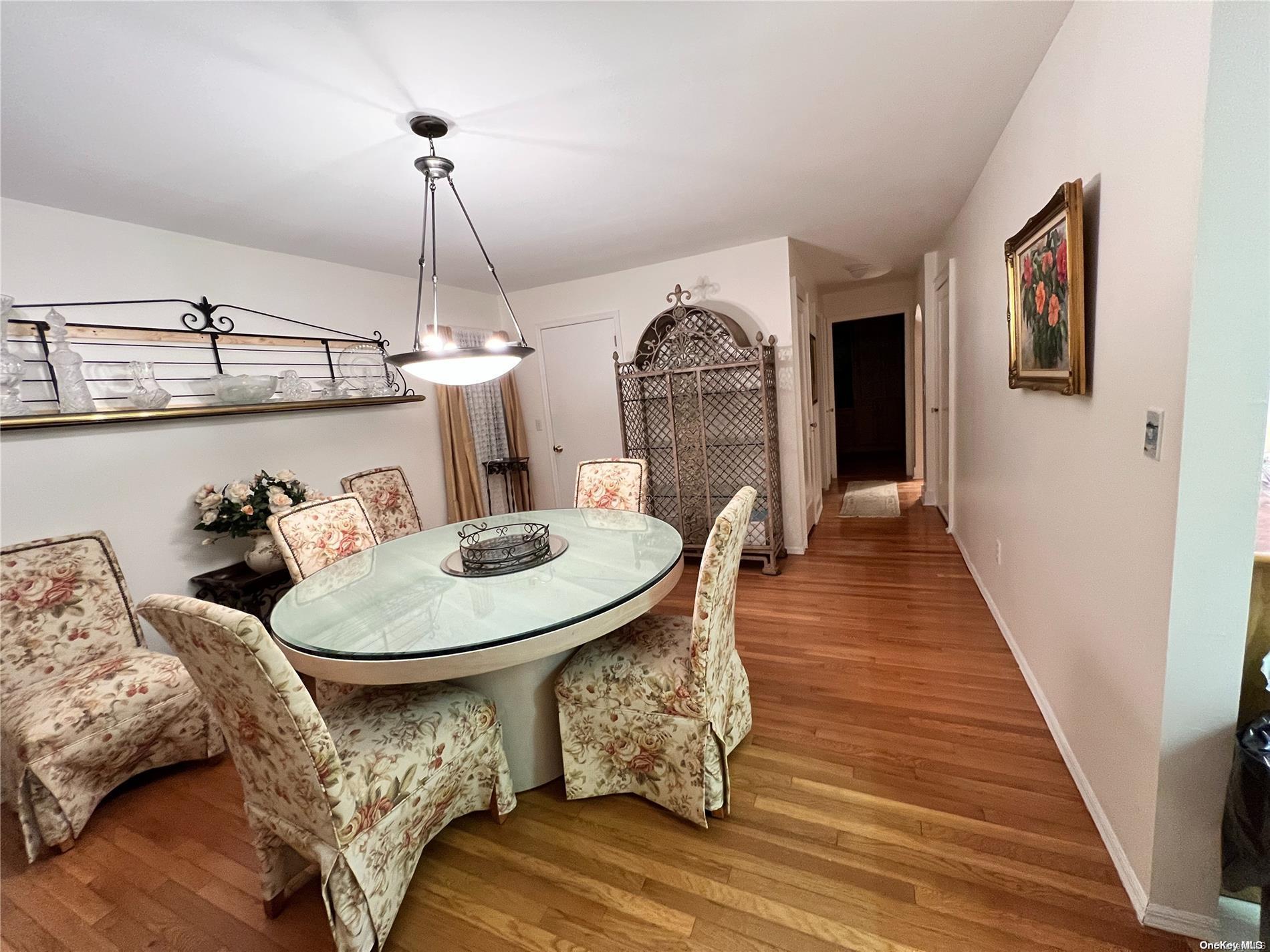 5 Lynncliff Road Hampton Bays, NY 11946 - Photo 13 of 31 a living room with furniture and wooden floor