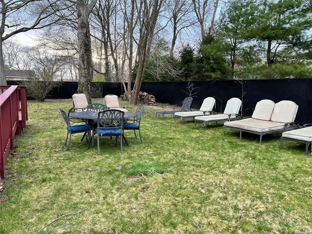 a gym room with furniture and a window