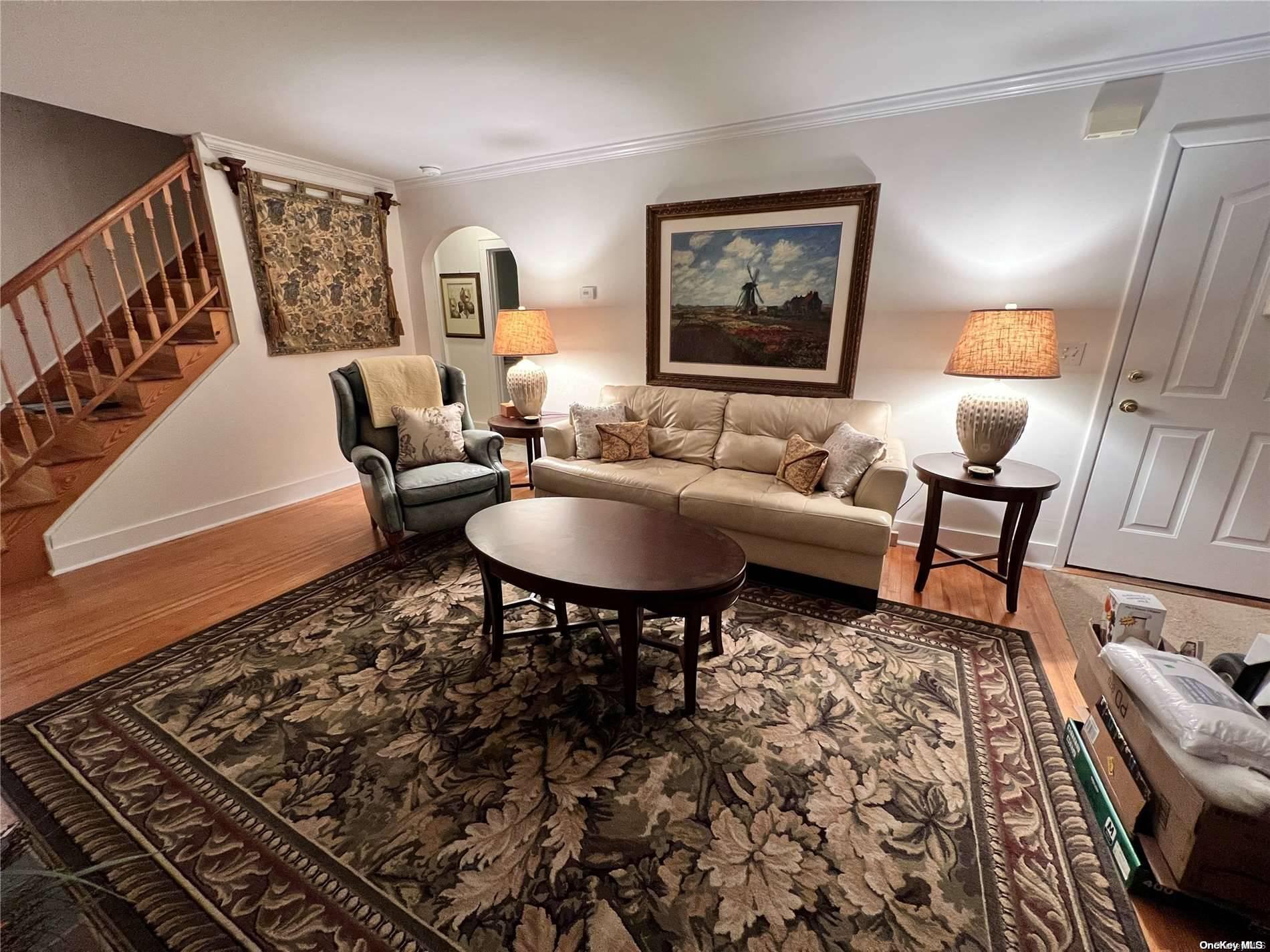 5 Lynncliff Road Hampton Bays, NY 11946 - Photo 2 of 31 a living room with furniture and a rug