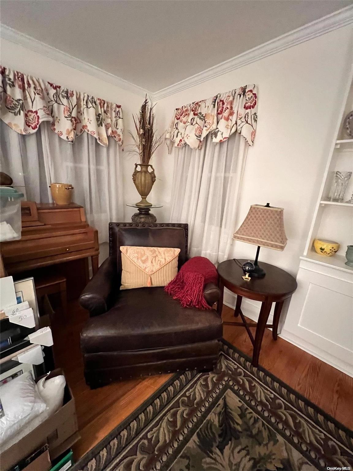 5 Lynncliff Road Hampton Bays, NY 11946 - Photo 5 of 31 a living room with furniture and wooden floor