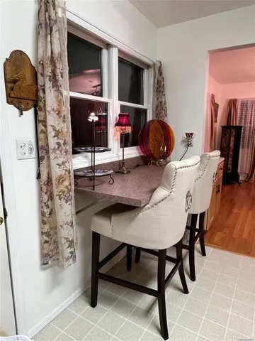 a workspace with furniture and window