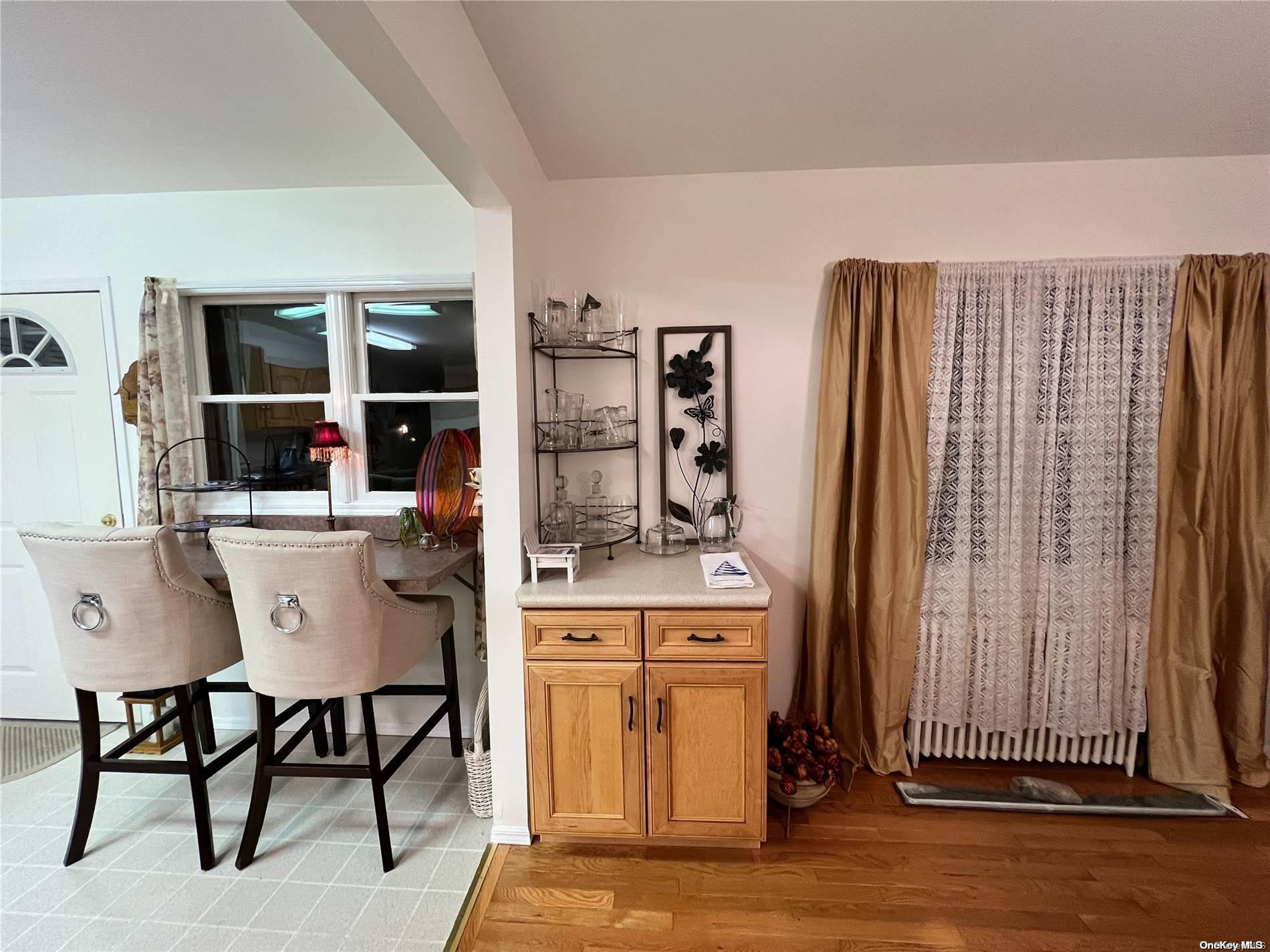 5 Lynncliff Road Hampton Bays, NY 11946 - Photo 9 of 31 a dining room with furniture and window