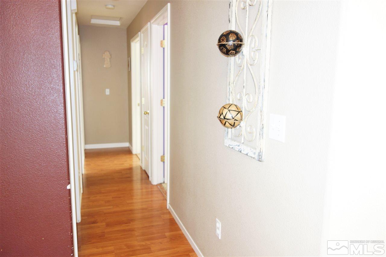 18470 Datewood Court Reno, NV 89508 - Photo 5 of 20 a view of a hallway with wooden floor