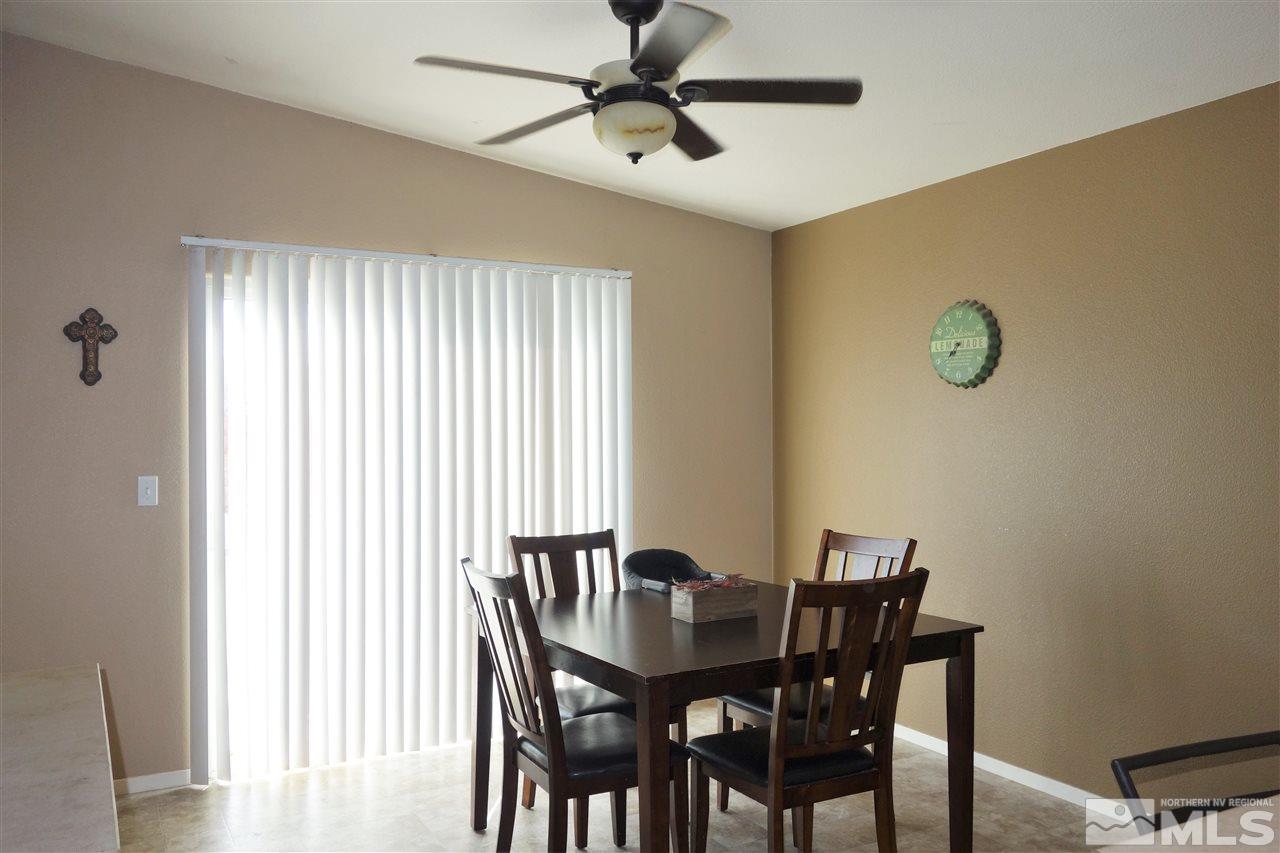 18470 Datewood Court Reno, NV 89508 - Photo 10 of 20 a view of a dining room with furniture and a window