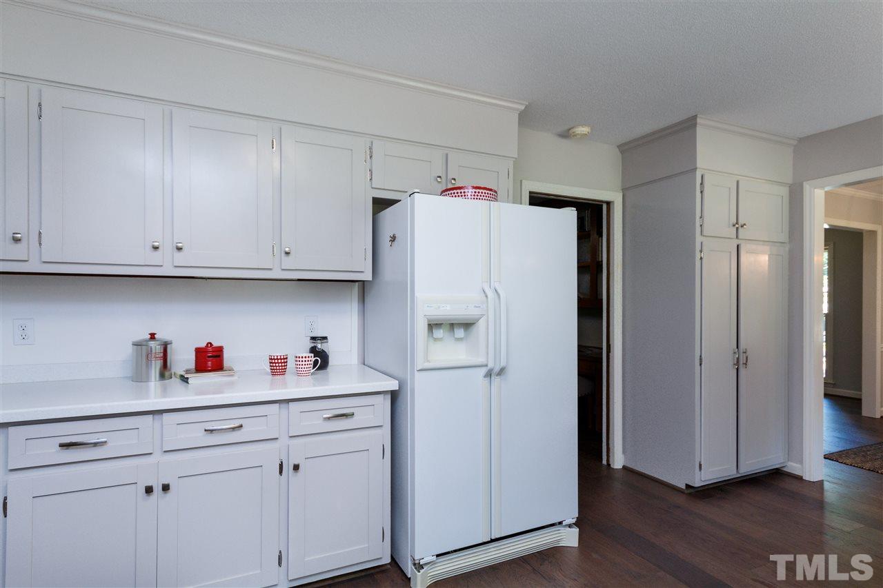 2911 Buckingham Road Durham, NC 27707 - Photo 11 of 25 a white refrigerator freezer sitting inside of a kitchen