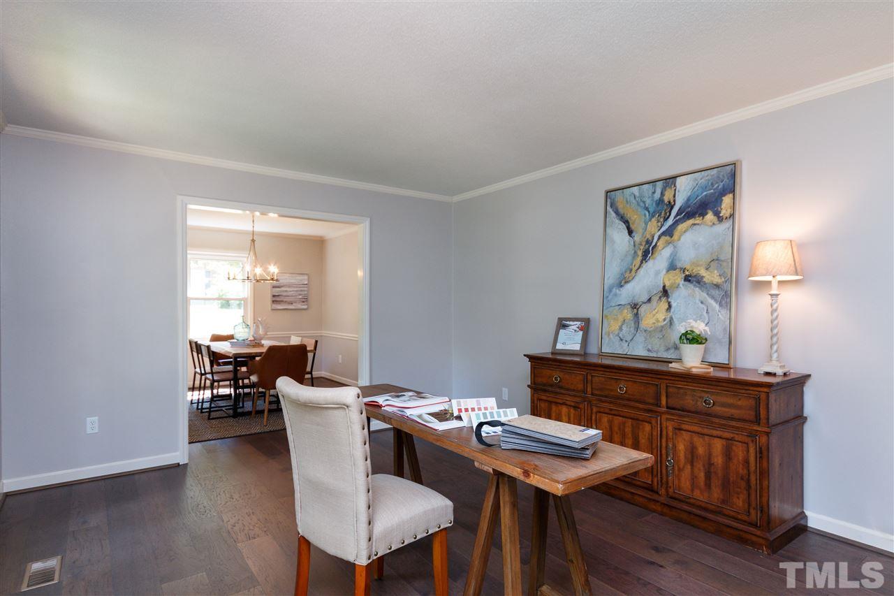 2911 Buckingham Road Durham, NC 27707 - Photo 3 of 25 a dining room with furniture and wooden floor