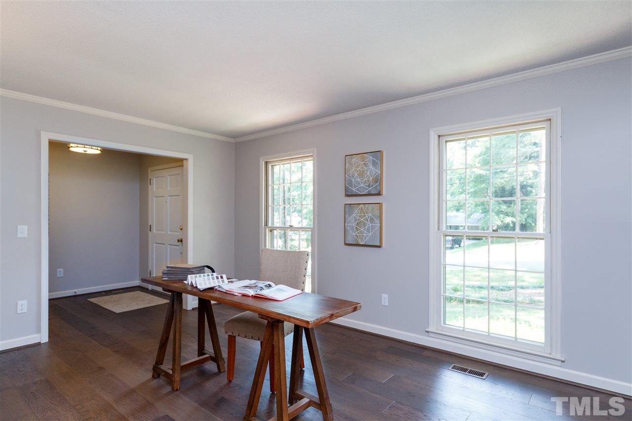 2911 Buckingham Road Durham, NC 27707 - Photo 4 of 25 a view of a workspace with furniture and a window